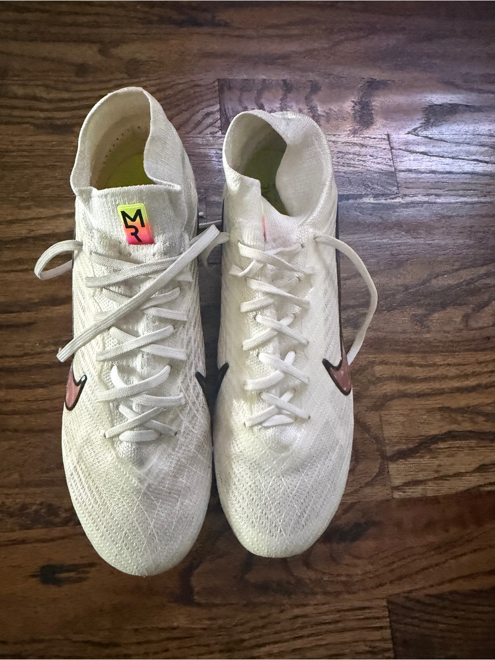 Nike White Soccer Cleats with Pink Swoosh and Neon Accent